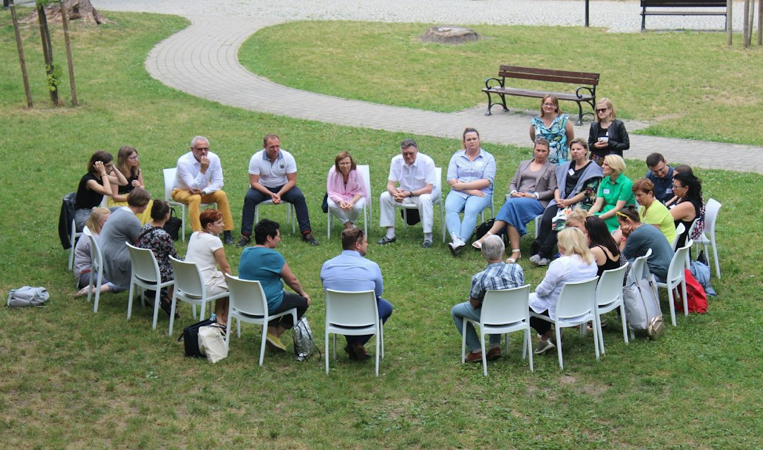 Community members seated in a circle for discussion